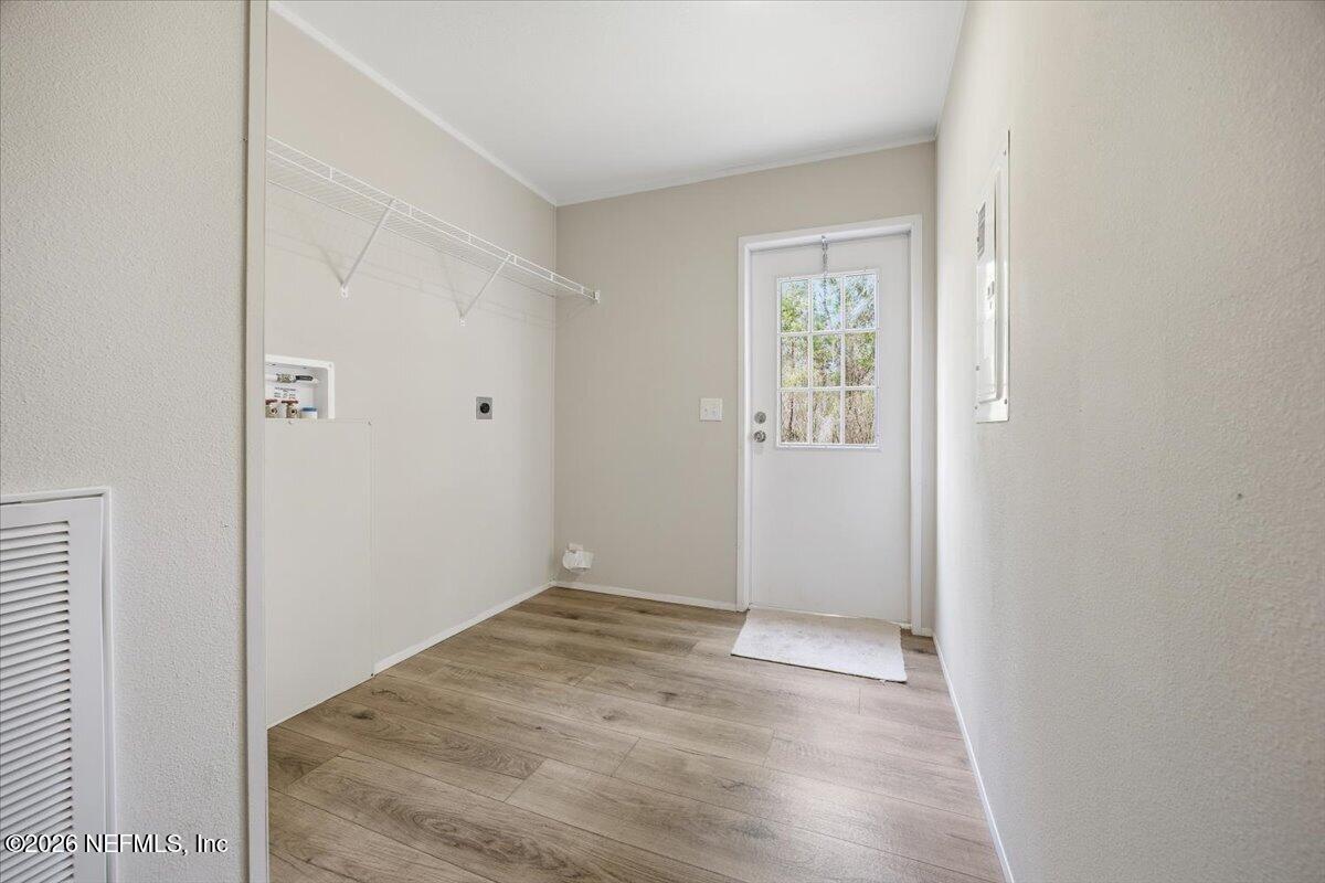 6067 Taft Road Macclenny, FL 32063 - Photo 21 of 23 a view of entryway with wooden floor