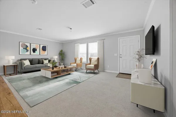 a living room with furniture and a flat screen tv