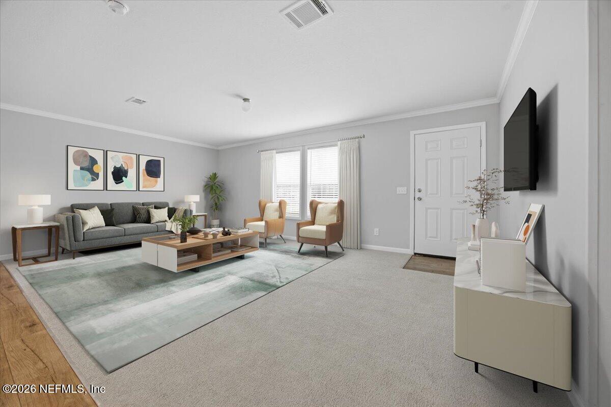 6067 Taft Road Macclenny, FL 32063 - Photo 5 of 23 a living room with furniture and a flat screen tv