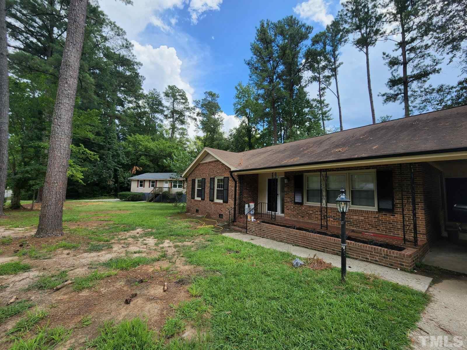 2764 Milburnie Road Raleigh, NC 27610 - Photo 2 of 39 a view of a house with a yard