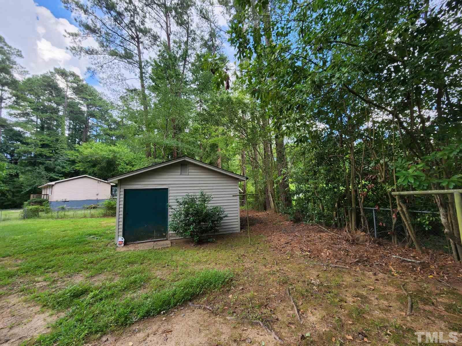 2764 Milburnie Road Raleigh, NC 27610 - Photo 39 of 39 a view of an outdoor space with a garden