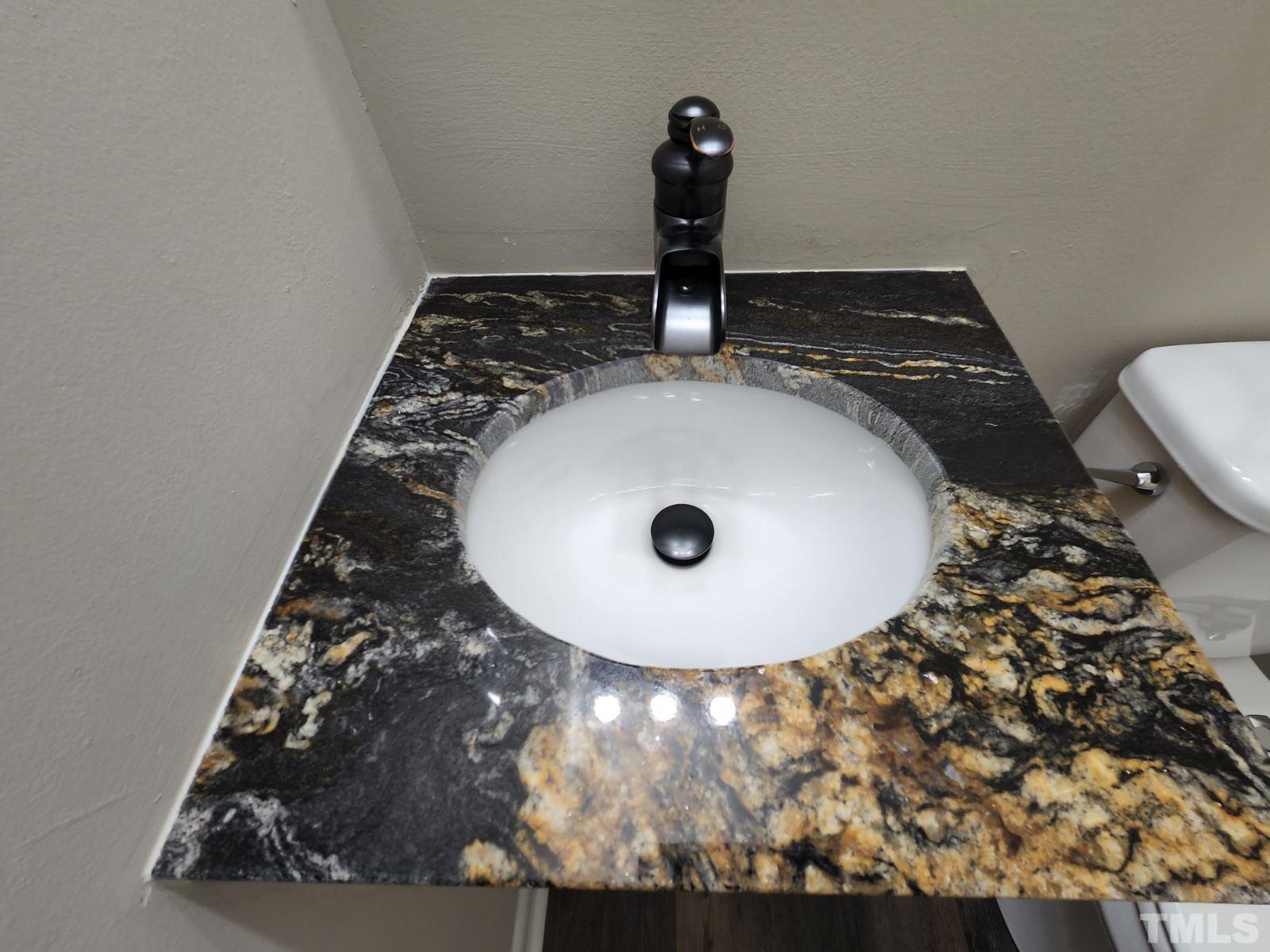 2764 Milburnie Road Raleigh, NC 27610 - Photo 7 of 39 a view of a sink in a bathroom