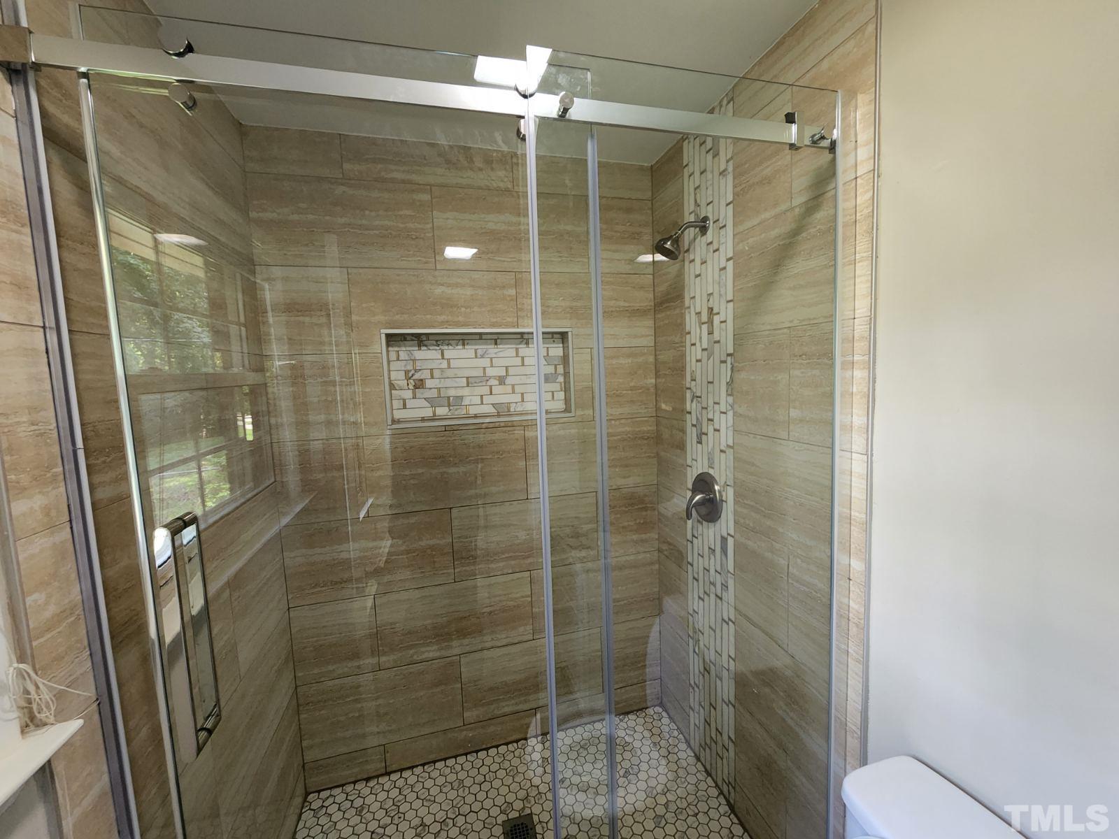 2764 Milburnie Road Raleigh, NC 27610 - Photo 9 of 39 a bathroom with a shower and a toilet