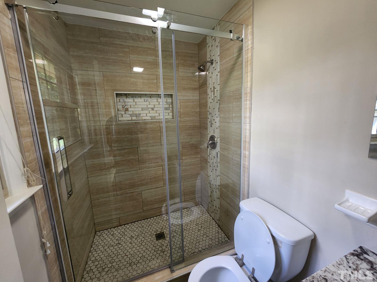 2764 Milburnie Road Raleigh, NC 27610 - Photo 10 of 39 a bathroom with a shower and toilet