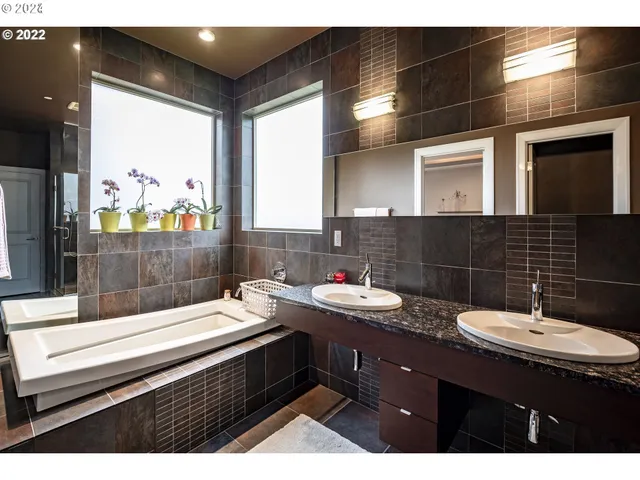 a bathroom with a sink double vanity and a mirror