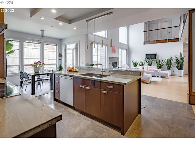 a kitchen with a stove a sink and a refrigerator