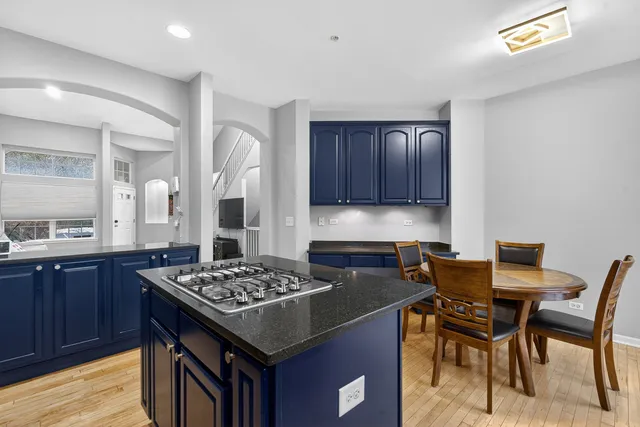 a kitchen with a table and chairs in it