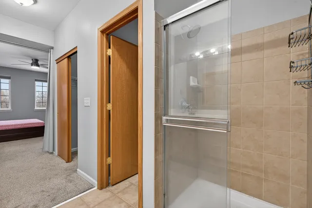 a bathroom with a tub and shower