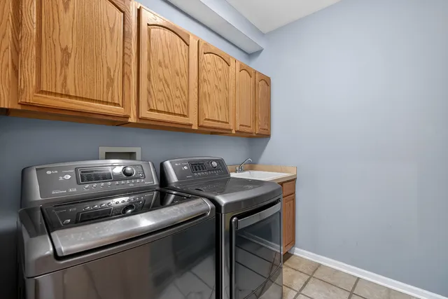 a view of a brick house with a yard