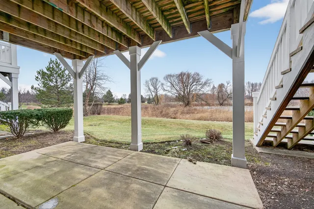 a sign board with parking space in back