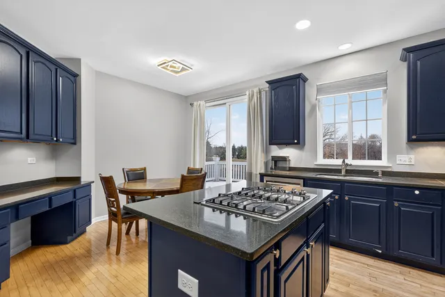 a kitchen with a stove and a refrigerator