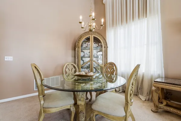 a room with furniture and a baby crib