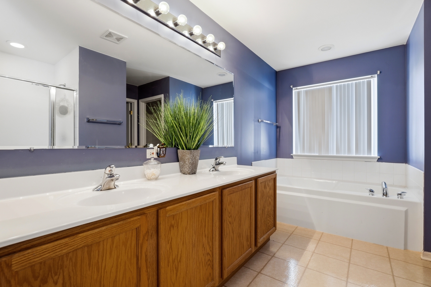749 Lenox Avenue Bolingbrook, IL 60490 - Photo 17 of 33 a bathroom with a sink double vanity granite tub shower and a mirror