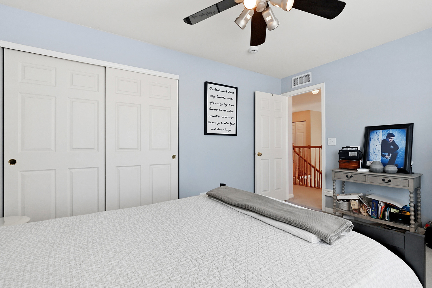 749 Lenox Avenue Bolingbrook, IL 60490 - Photo 19 of 33 a bedroom with a bed and a chandelier