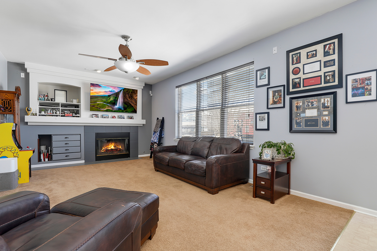 749 Lenox Avenue Bolingbrook, IL 60490 - Photo 2 of 33 a living room with furniture a fireplace and a flat screen tv
