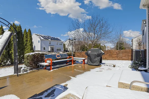 a view of a dirt road with a building in the background