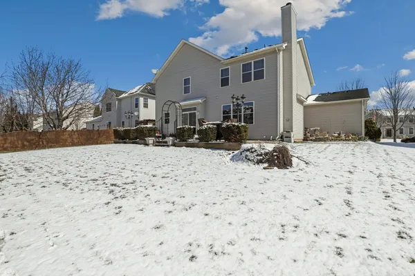 a view of the house with a yard