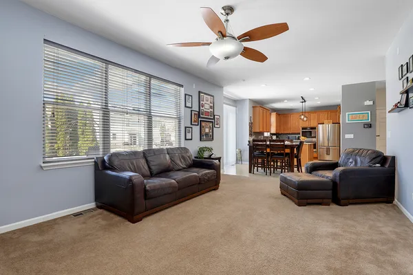 a living room with furniture and a large window