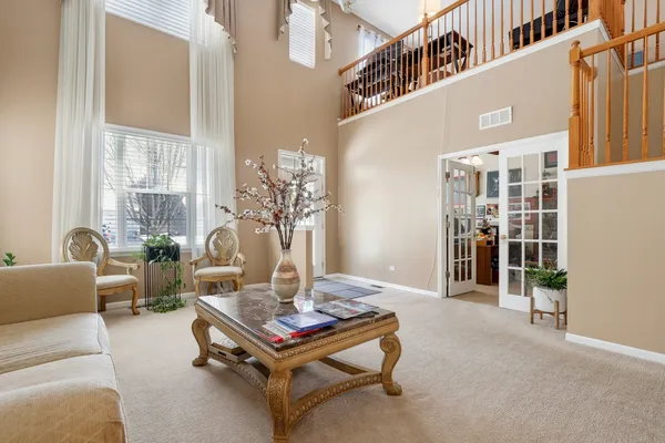 a living room with furniture and a table