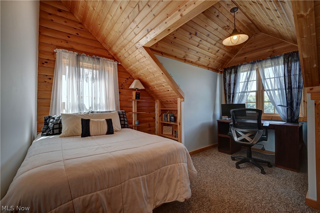 8045 McFadden Road Shreve, OH 44676 - Photo 34 of 45 Bedroom featuring a vaulted wooden ceiling, carpet, a desk, and multiple windows