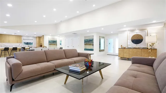 a view of living room with furniture and wooden floor