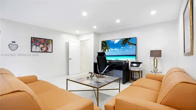 a front view of a house with a yard table and chairs