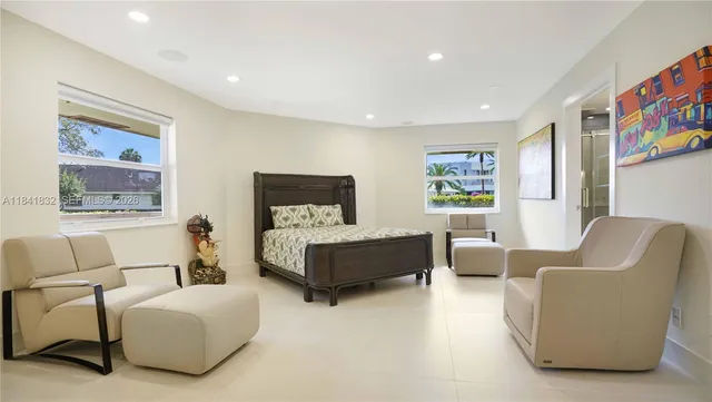 an aerial view of a residential houses with outdoor space