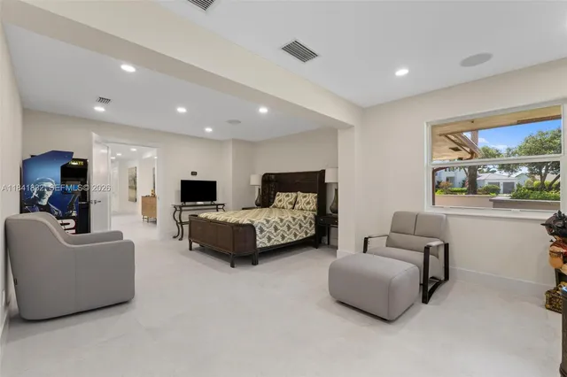 an aerial view of a house with a garden and trees