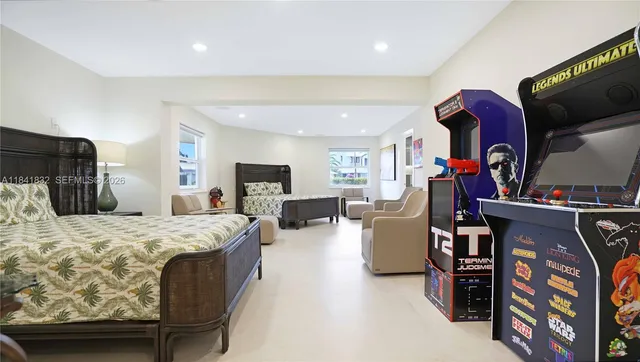 an aerial view of residential houses with outdoor space and trees