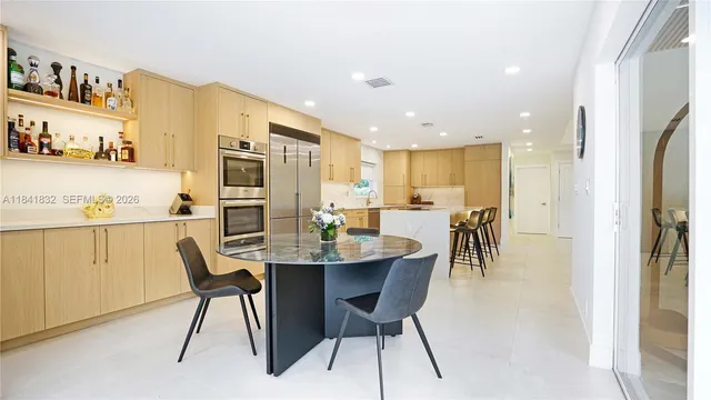 a living room with furniture and a gym equipment
