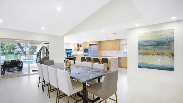 a bed room with furniture and a large window