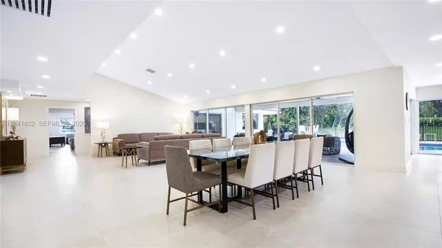 a bed room with furniture and a mirror