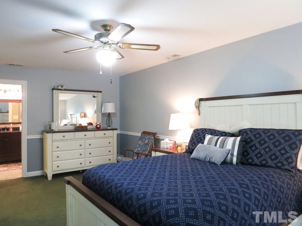 4516 Wingate Drive Raleigh, NC 27609 - Photo 15 of 25 a bedroom with a bed and window