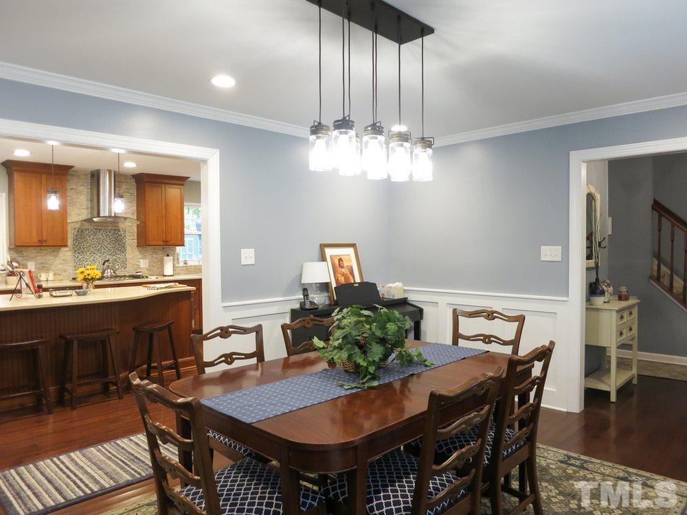 4516 Wingate Drive Raleigh, NC 27609 - Photo 6 of 25 a view of a dining room with furniture and wooden floor