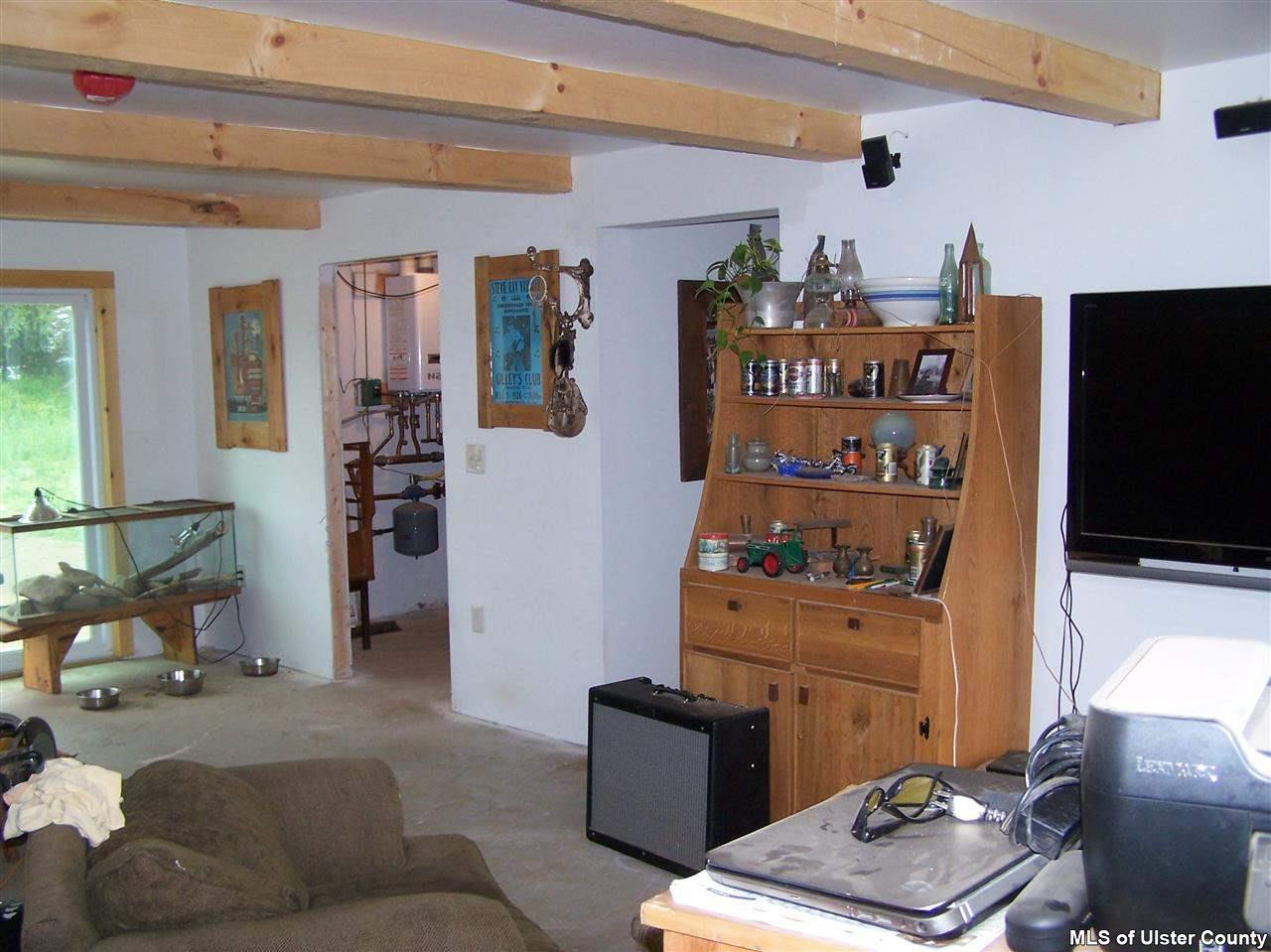 60 Piazza Road Kerhonkson, NY 12446 - Photo 11 of 14 a living room with furniture and a flat screen tv
