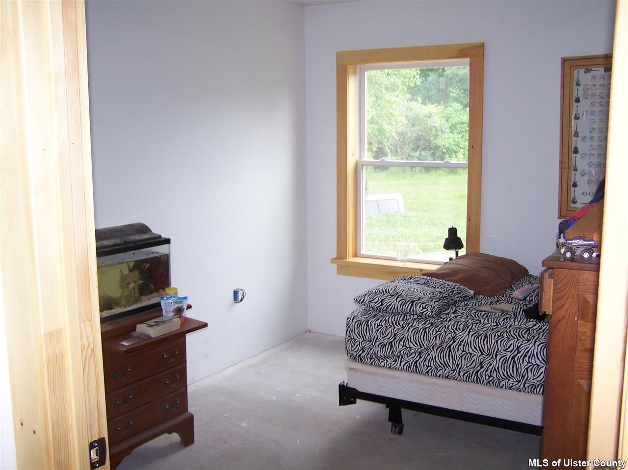 60 Piazza Road Kerhonkson, NY 12446 - Photo 6 of 14 a living room with furniture and a window