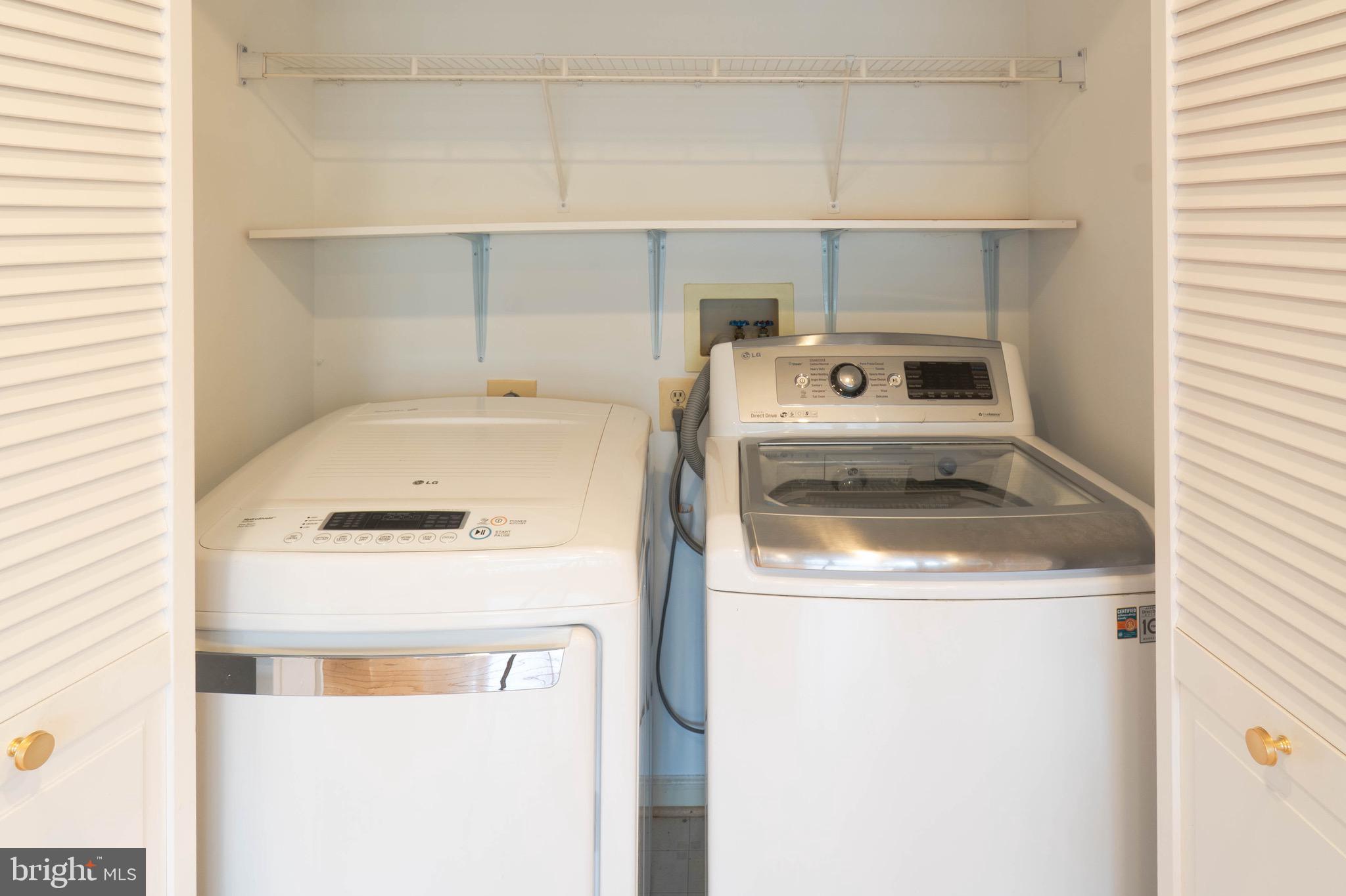 9407 Copernicus Drive Lanham, MD 20706 - Photo 16 of 48 a utility room with dryer and washer