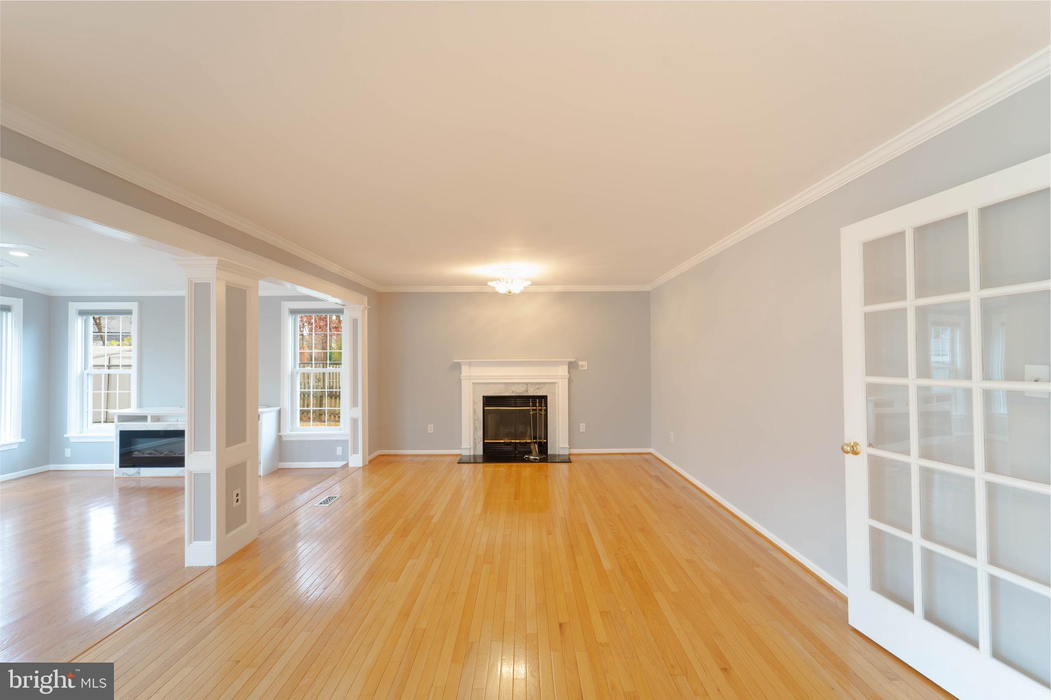 9407 Copernicus Drive Lanham, MD 20706 - Photo 17 of 48 a view of a livingroom with wooden floor and fireplace
