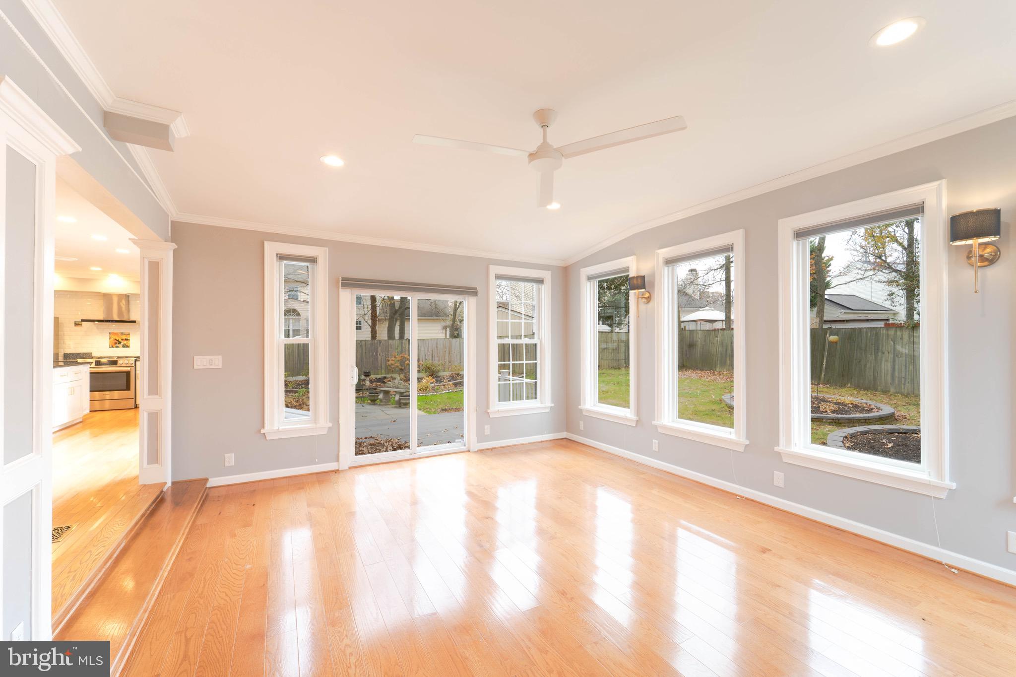 9407 Copernicus Drive Lanham, MD 20706 - Photo 21 of 48 a view of an empty room with wooden floor and a window