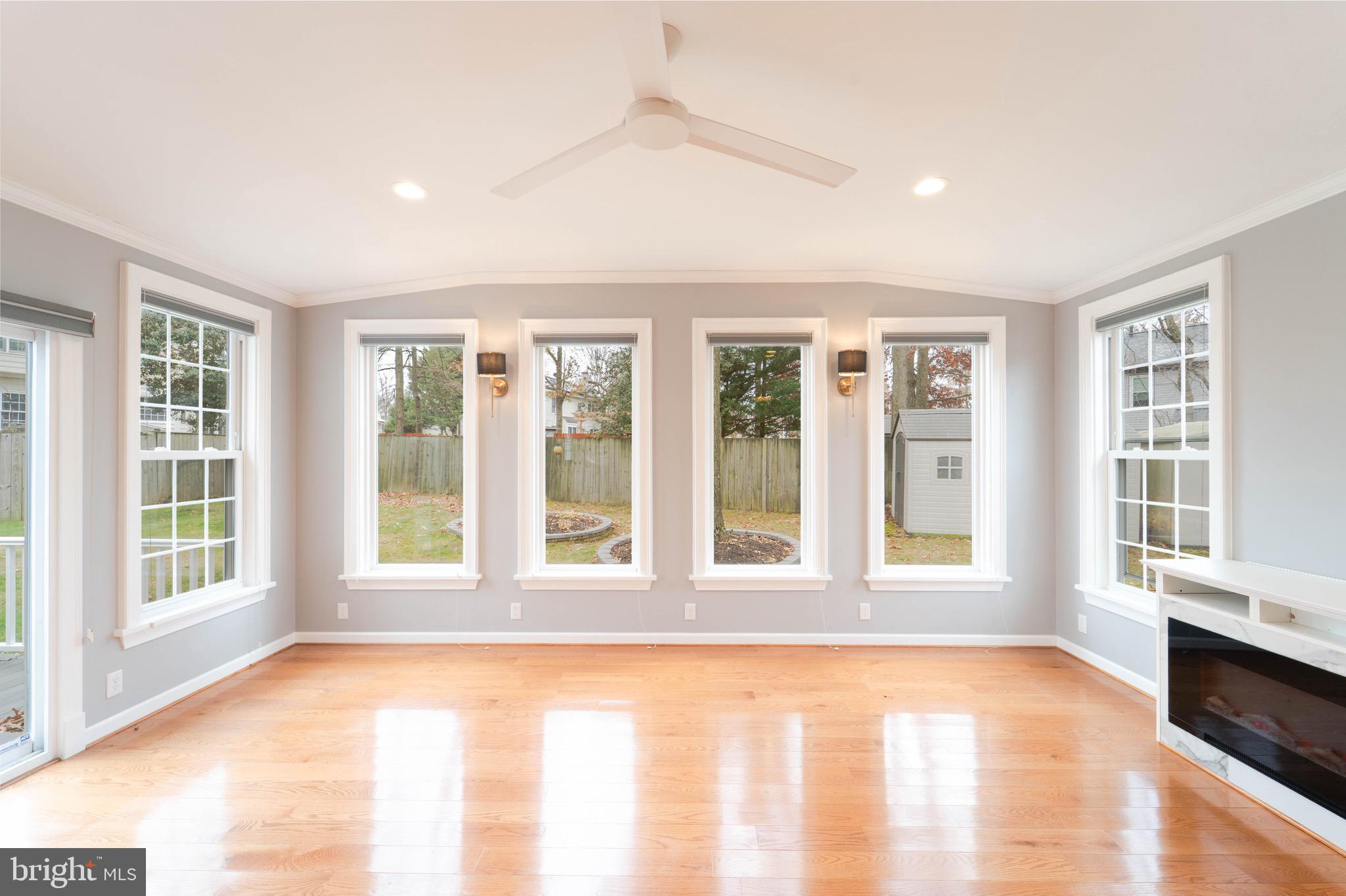 9407 Copernicus Drive Lanham, MD 20706 - Photo 22 of 48 a view of an empty room with wooden floor and a window