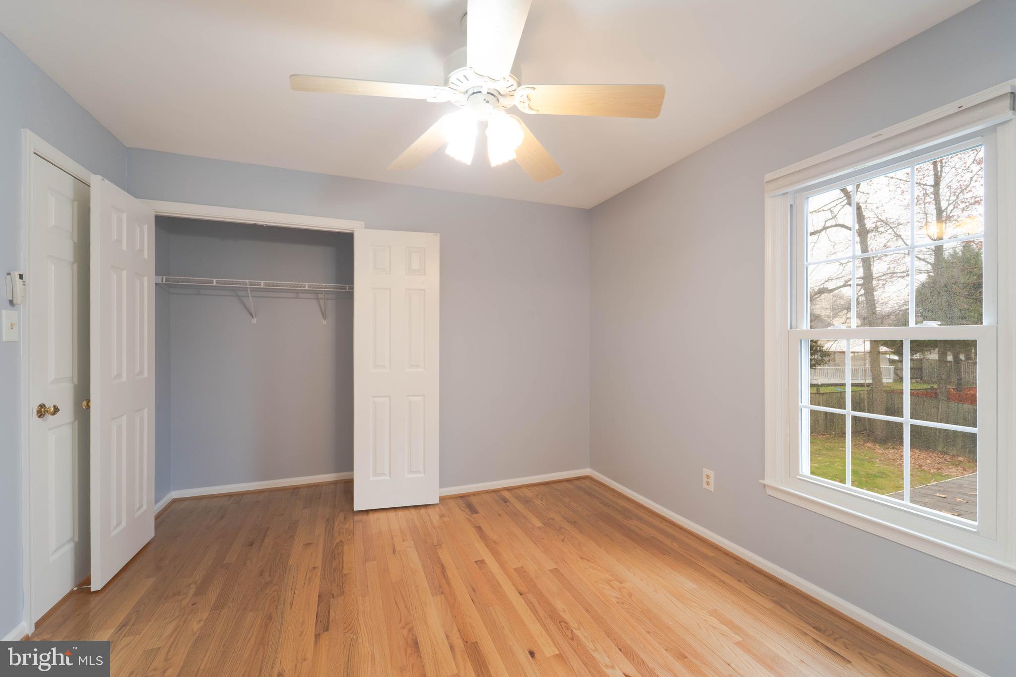 9407 Copernicus Drive Lanham, MD 20706 - Photo 29 of 48 wooden floor in an empty room with a window