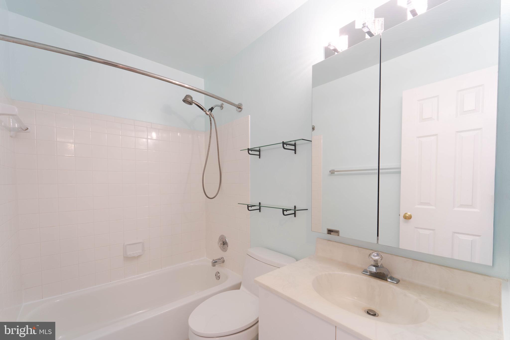 9407 Copernicus Drive Lanham, MD 20706 - Photo 34 of 48 a bathroom with a sink toilet and shower