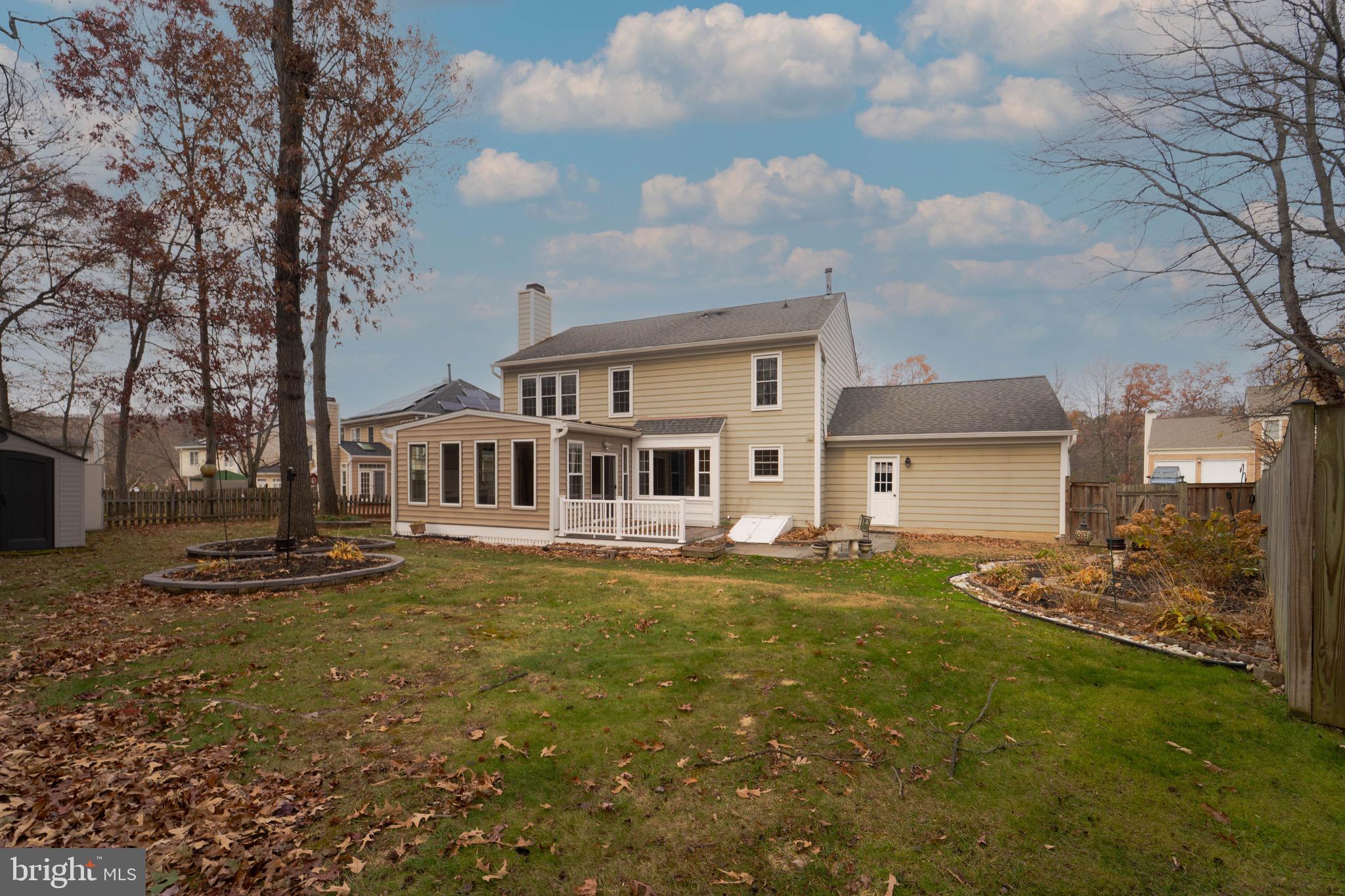 9407 Copernicus Drive Lanham, MD 20706 - Photo 43 of 48 a front view of a house with a garden