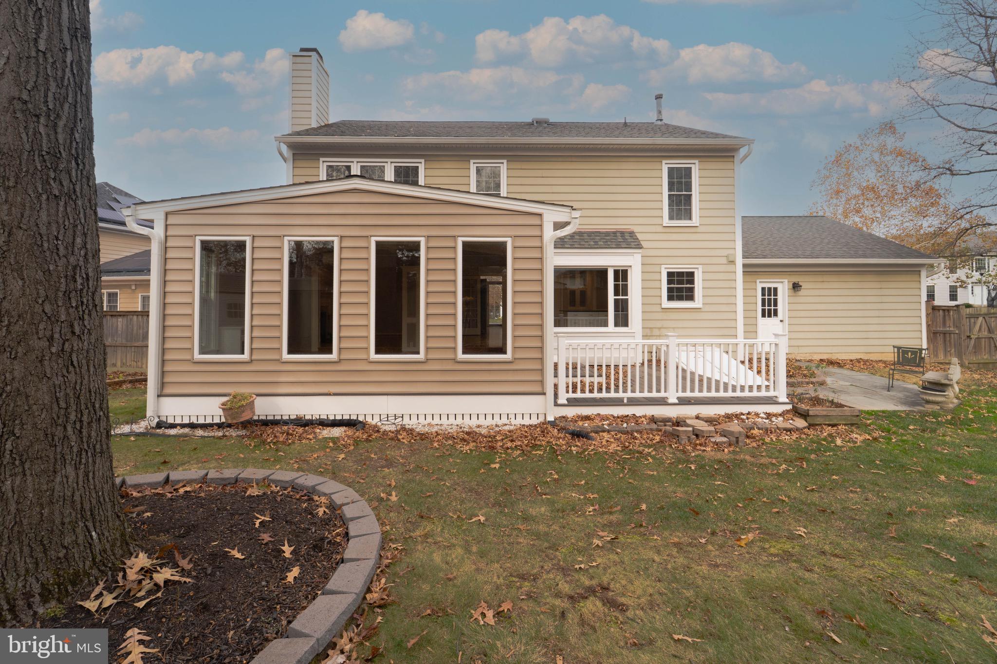 9407 Copernicus Drive Lanham, MD 20706 - Photo 44 of 48 a front view of a house with a garden