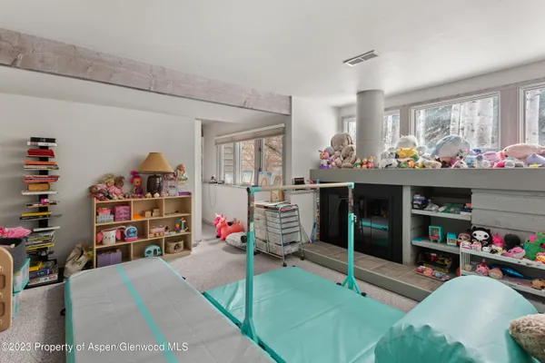 a living room with lots of furniture and a flat screen tv