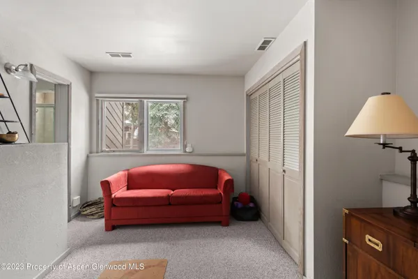 a room with furniture and a window