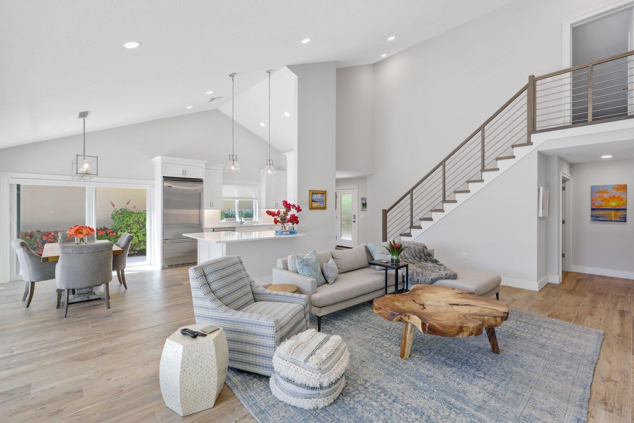 215 Ridge Road Jupiter, FL 33477 - Photo 1 of 43 a living room with furniture and a dining table with wooden floor