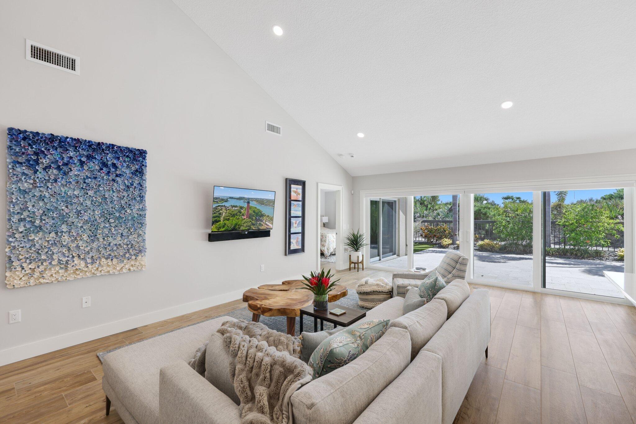 215 Ridge Road Jupiter, FL 33477 - Photo 17 of 43 a living room with furniture and a flat screen tv