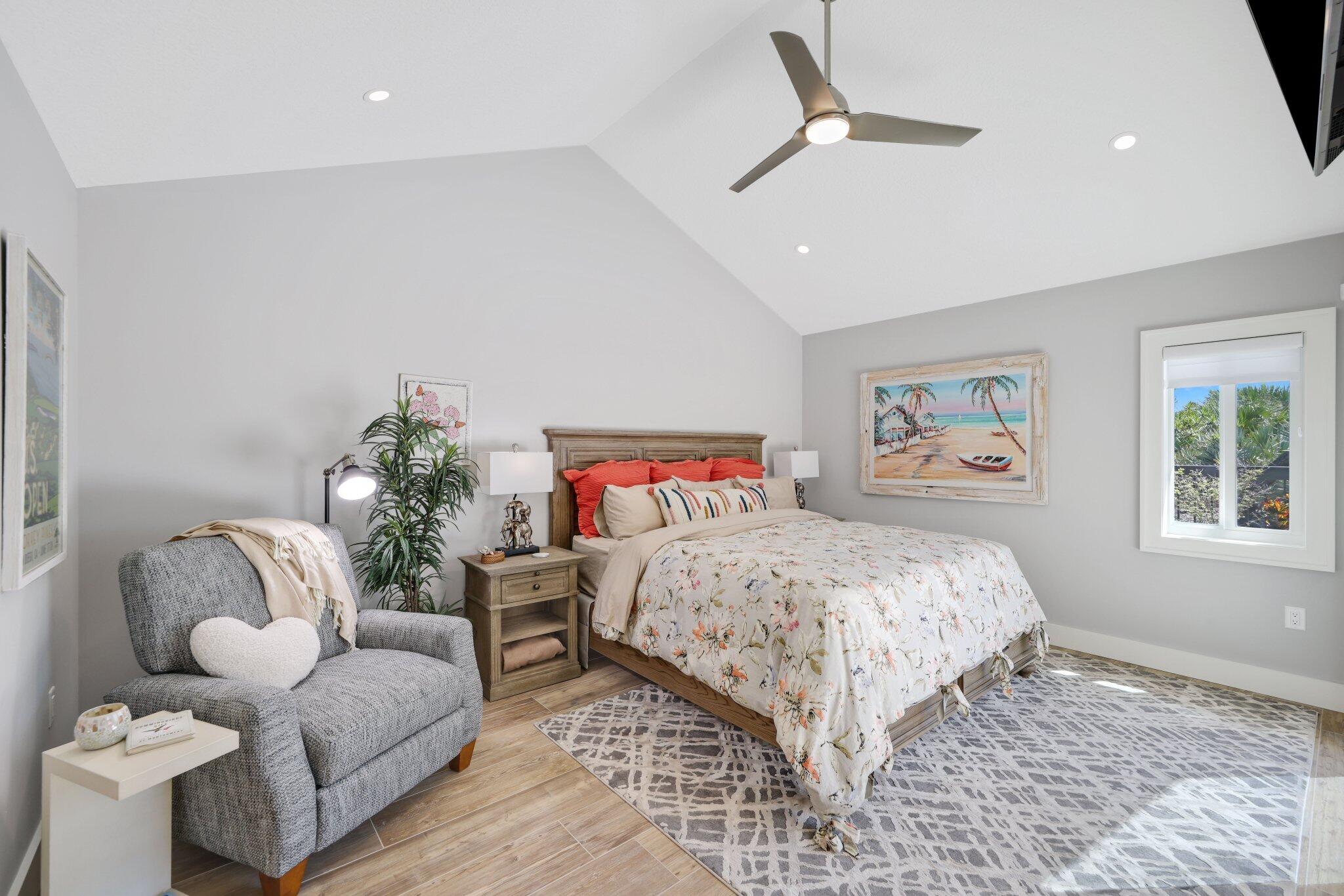 215 Ridge Road Jupiter, FL 33477 - Photo 18 of 43 a bedroom with a bed couch and window