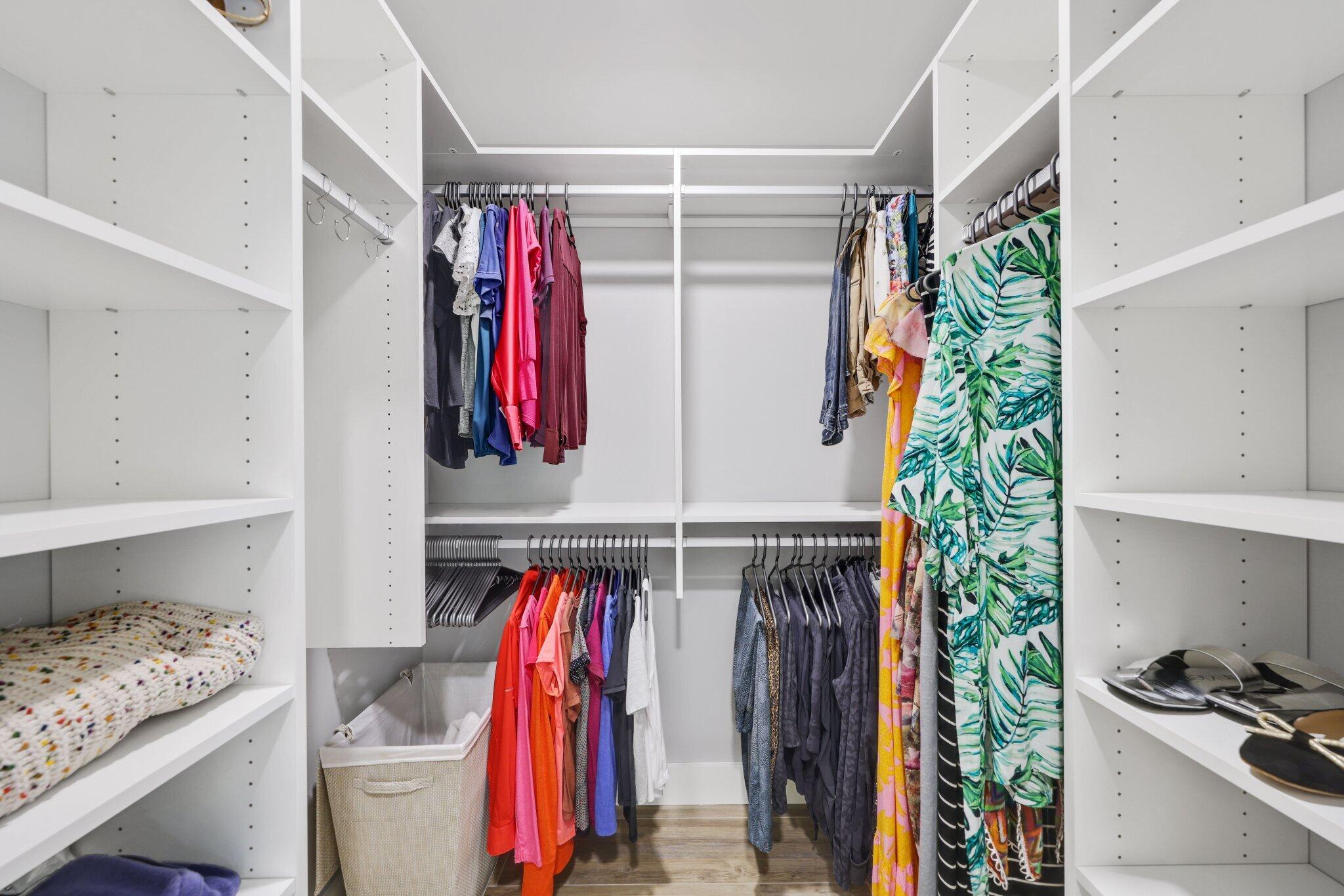 215 Ridge Road Jupiter, FL 33477 - Photo 21 of 43 a view of walk in closet with clothes and shoes